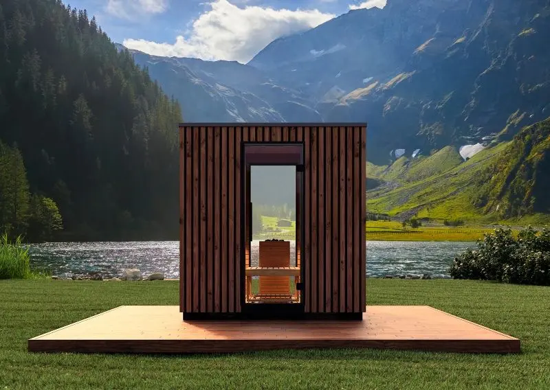 Sauna cabin on a wooden deck in open countryside